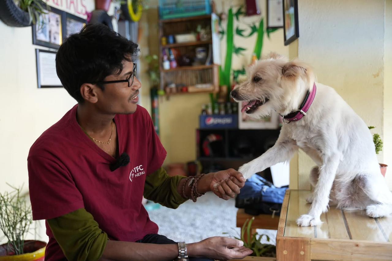 TFC Nepal rescue volunteer holding a rescued animal